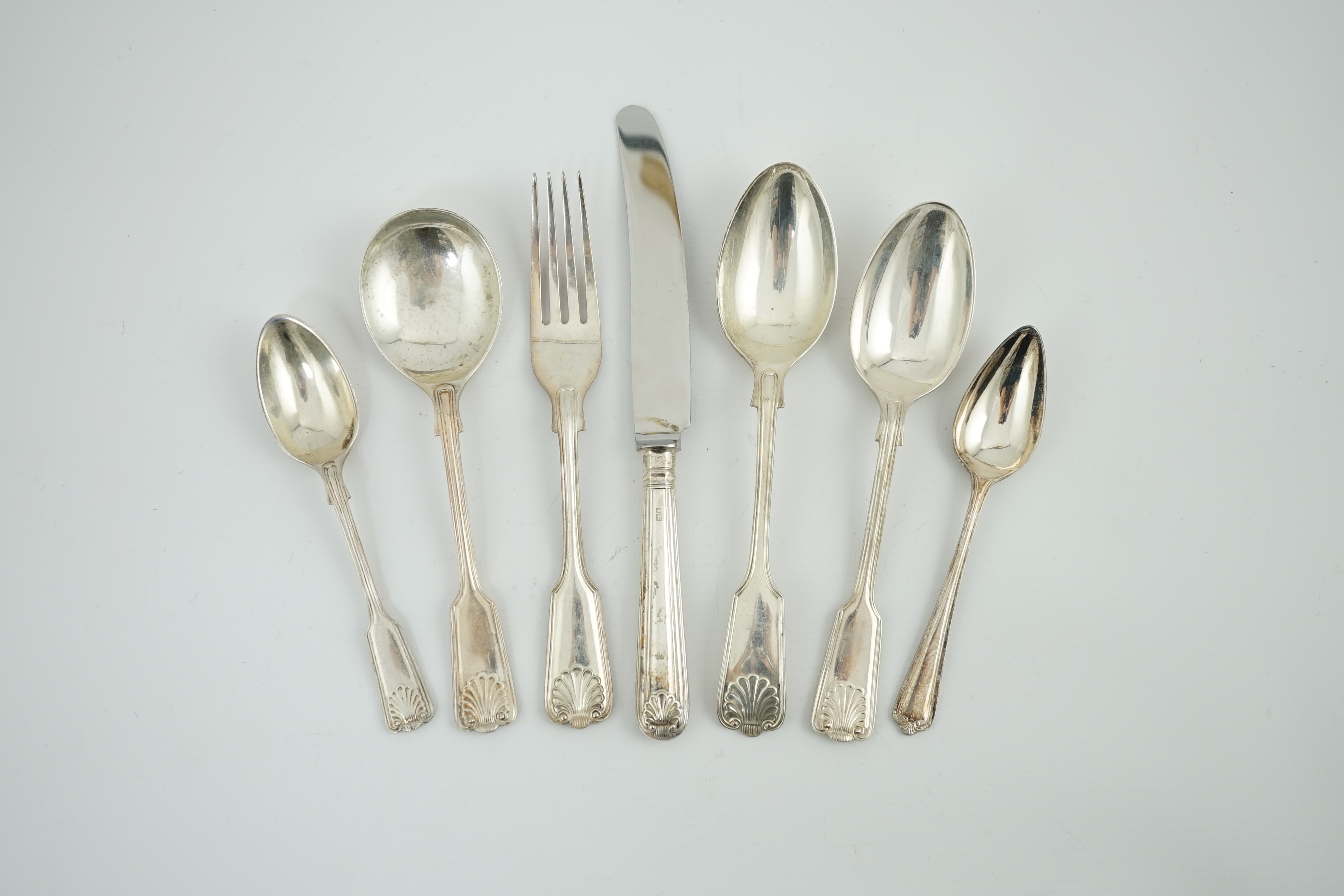 A matched part canteen of modern silver fiddle, thread and shell pattern cutlery, by Roberts & Belk and Cooper Brothers & Sons